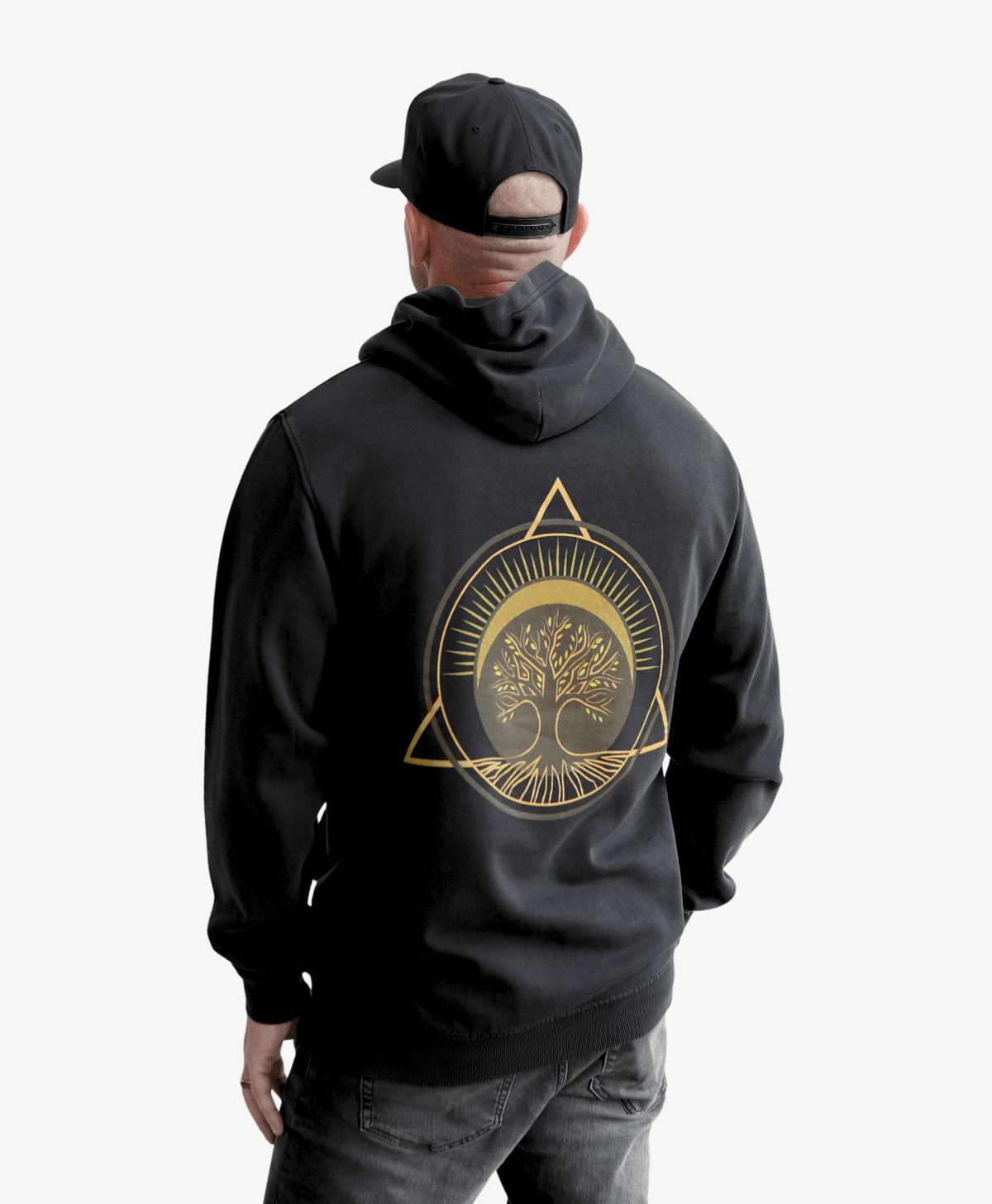 Man seen from behind wearing the black Tree of Life vintage hoodie with the gold symbol