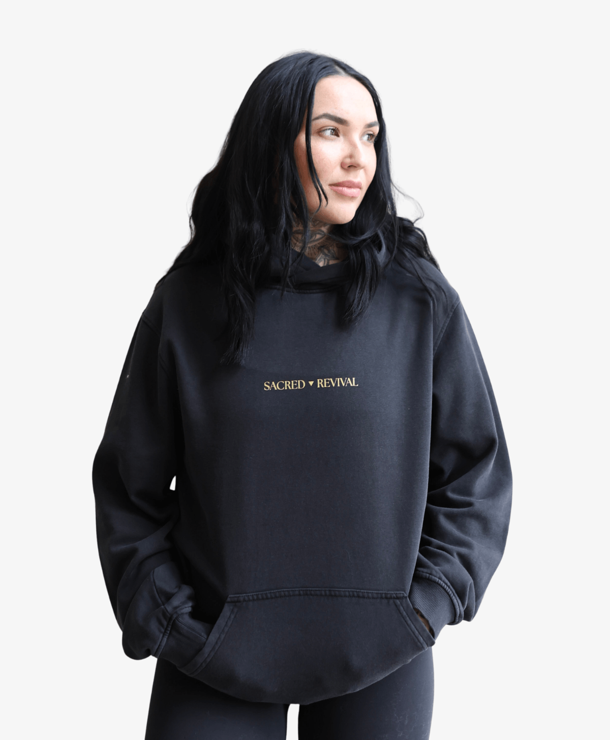 Woman wearing the black Tree of Life vintage hoodie, front view