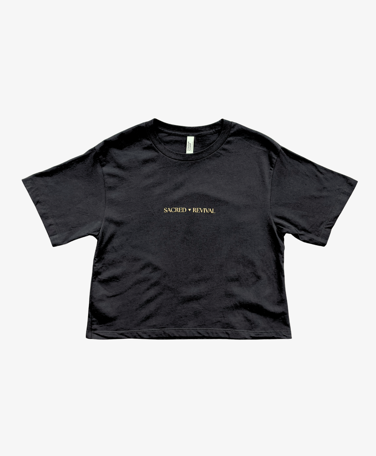 Black Tree of Life boxy tee, front view, with the Sacred Revival wordmark in gold on the chest