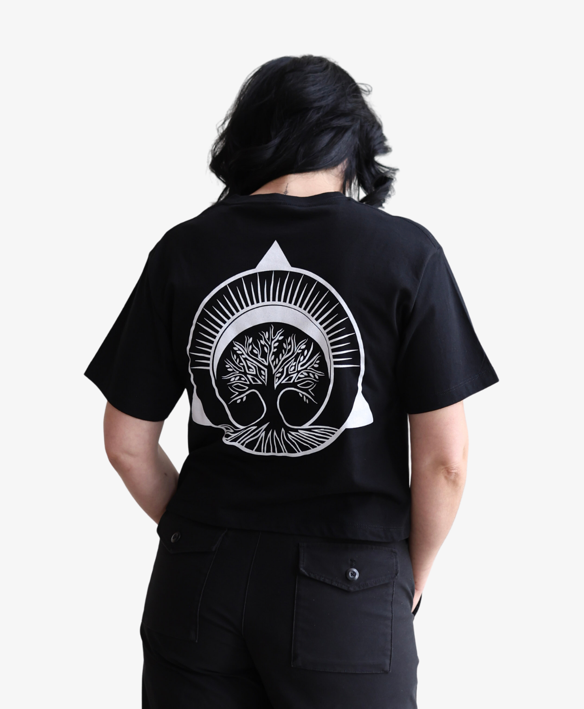 Woman seen from behind wearing the black Tree of Life boxy tee