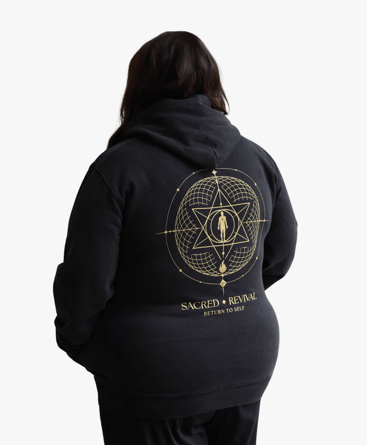 Woman seen from behind wearing the black Return to Self hoodie
