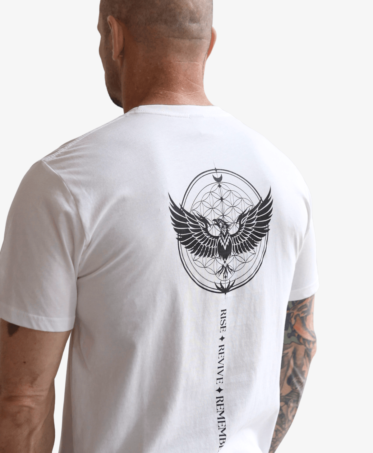 Man seen from behind wearing the white Phoenix Rising tee, close crop