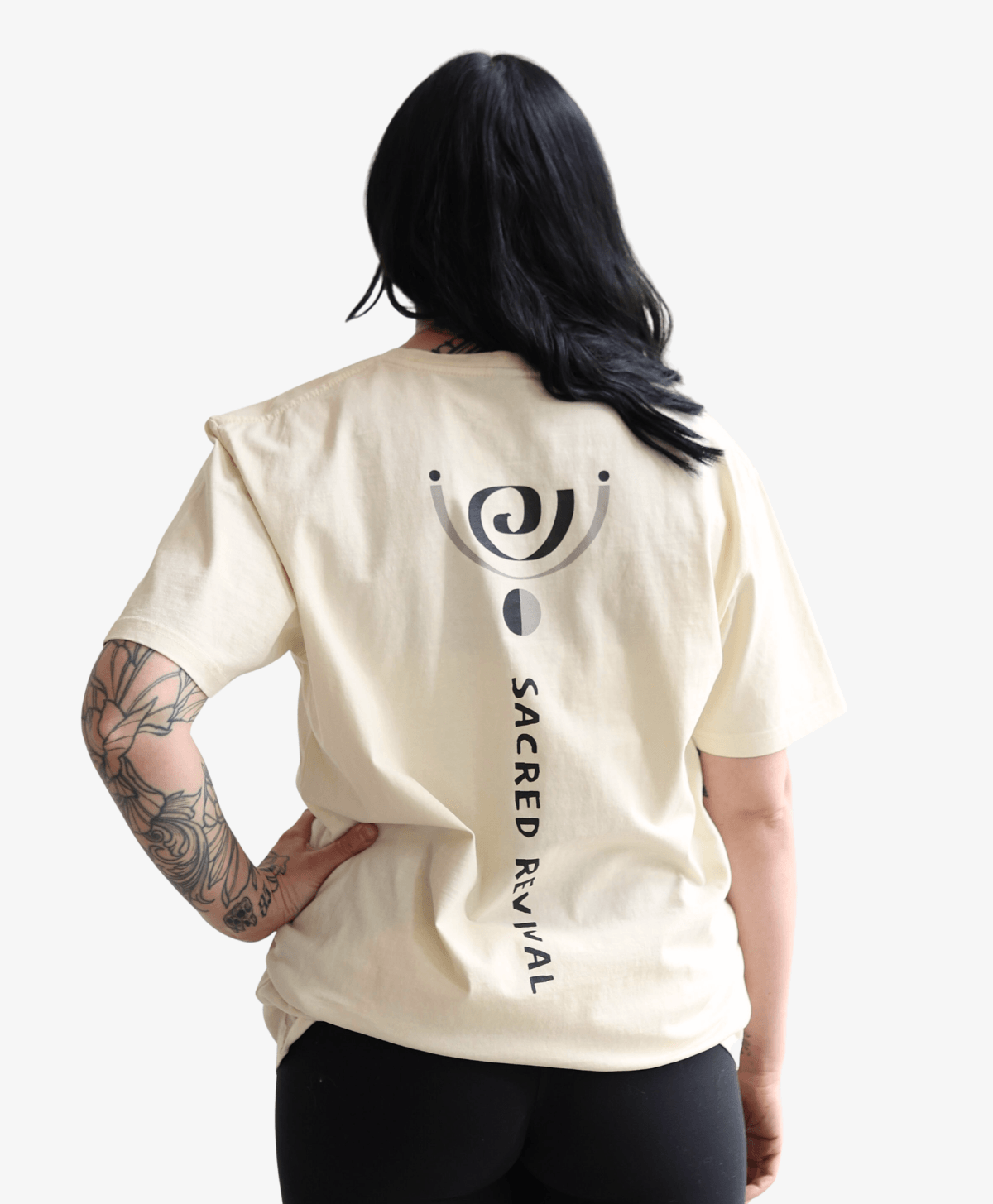 Woman seen from behind wearing the cream Spiral tee